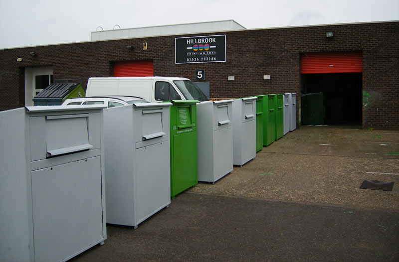 A row of clothing banks outside the workshop