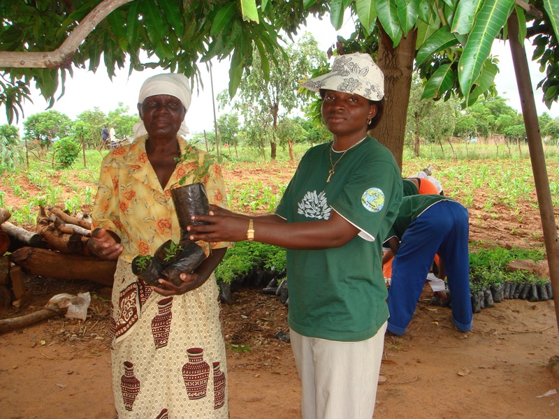 A Humana team member with a local woman
