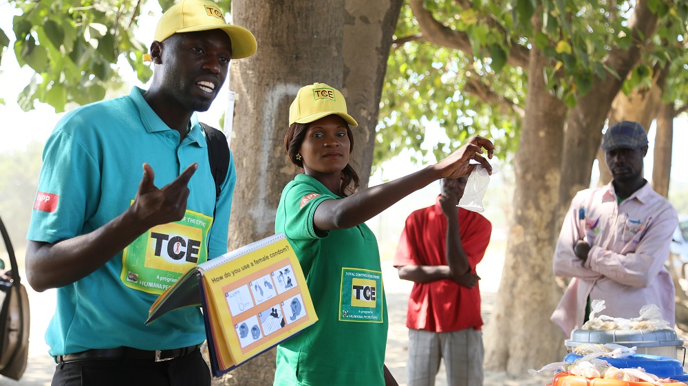 DAPP Zambia at a local market having a demonstration on how to use a female condomWS